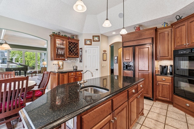 130 Stonebridge Rd, Lilydale, MN 55118 - kitchen with arched walkways, a sink, brown cabinetry, glass insert cabinets, and lofted ceiling