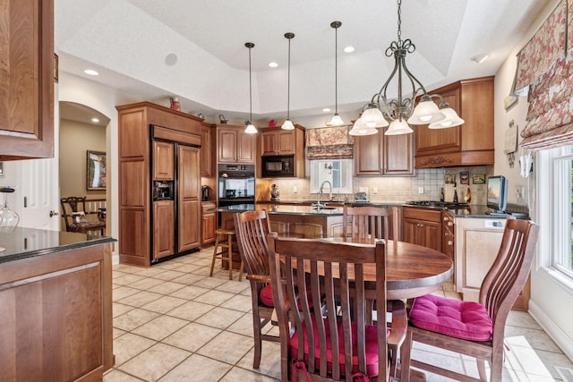 130 Stonebridge Rd, Lilydale, MN 55118 - dining area featuring arched walkways, recessed lighting, and light tile patterned flooring