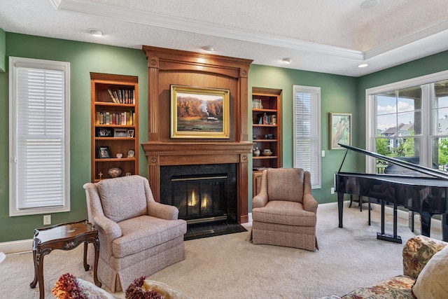 130 Stonebridge Rd, Lilydale, MN 55118 - living area with ornamental molding, carpet flooring, baseboards, a large fireplace, and a raised ceiling