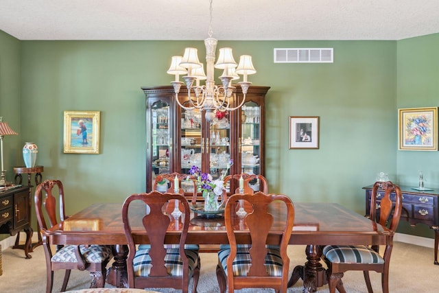130 Stonebridge Rd, Lilydale, MN 55118 - dining room with light colored carpet, a chandelier, and baseboards