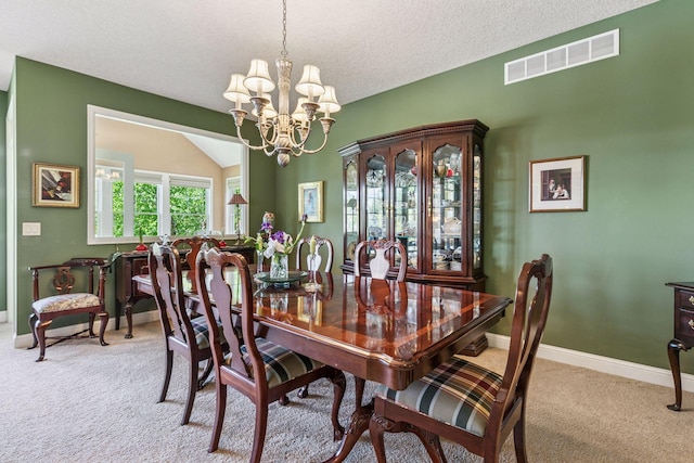 130 Stonebridge Rd, Lilydale, MN 55118 - carpeted dining space featuring a chandelier, baseboards, and a textured ceiling
