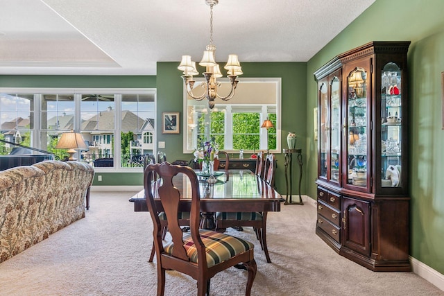 130 Stonebridge Rd, Lilydale, MN 55118 - dining area featuring a chandelier, carpet floors, baseboards, and a textured ceiling