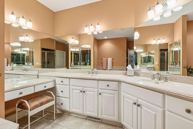 130 Stonebridge Rd, Lilydale, MN 55118 - full bath with a shower stall, double vanity, and tile patterned floors