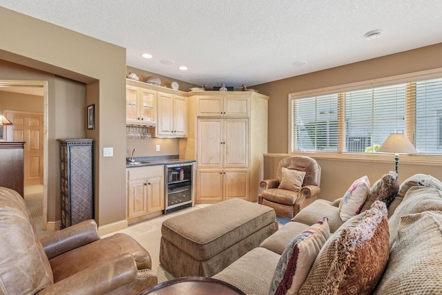 130 Stonebridge Rd, Lilydale, MN 55118 - living area featuring wine cooler, bar with sink, a textured ceiling, and recessed lighting