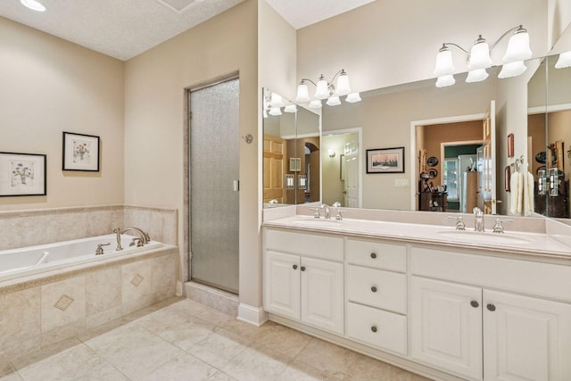 130 Stonebridge Rd, Lilydale, MN 55118 - bathroom featuring double vanity, a bath, a stall shower, and tile patterned floors