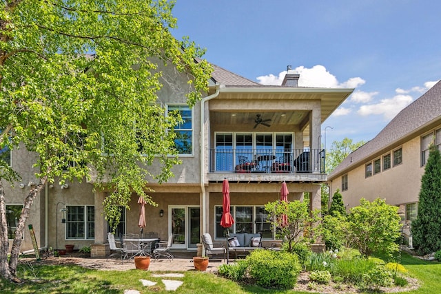 130 Stonebridge Rd, Lilydale, MN 55118 - rear view of property with a balcony, ceiling fan, stucco siding, an outdoor living space, and a patio area