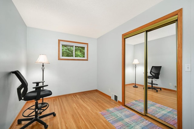 living area featuring wood finished floors and baseboards