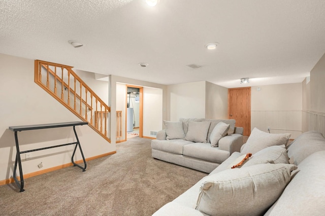 living room with carpet, stairway, and baseboards