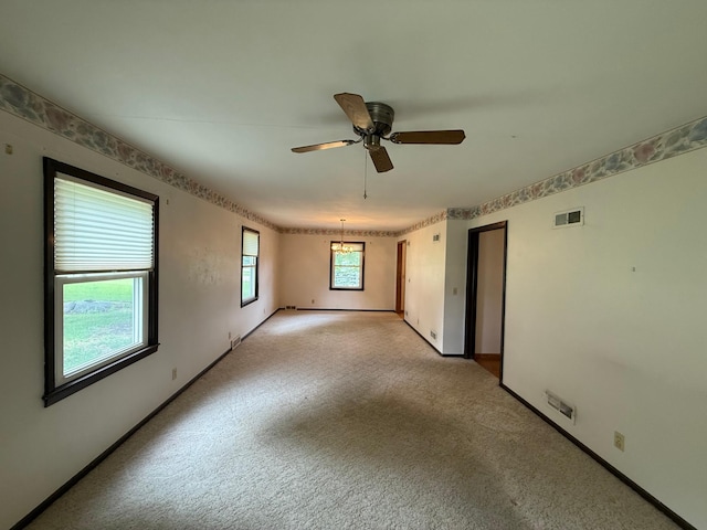 421 Oxford St W, Worthington, MN 56187 - empty room featuring light colored carpet, ceiling fan, and baseboards