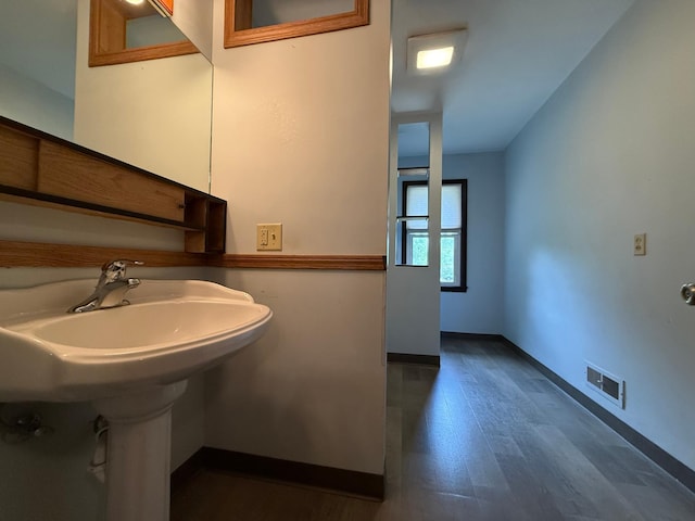 421 Oxford St W, Worthington, MN 56187 - bathroom with baseboards and wood finished floors