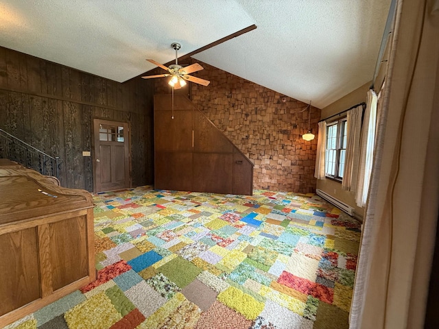 421 Oxford St W, Worthington, MN 56187 - recreation room with vaulted ceiling, a ceiling fan, a textured ceiling, baseboard heating, and wooden walls