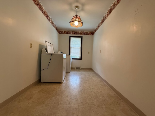 421 Oxford St W, Worthington, MN 56187 - laundry area with washer and dryer and baseboards