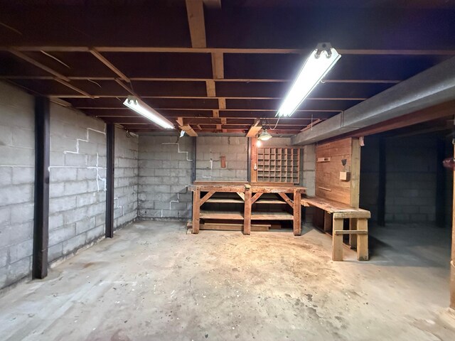 421 Oxford St W, Worthington, MN 56187 - unfinished below grade area with a workshop area and concrete block wall