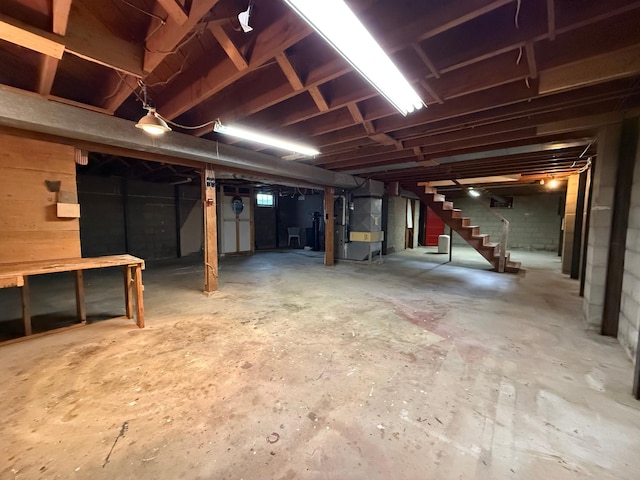 421 Oxford St W, Worthington, MN 56187 - unfinished below grade area featuring stairway and heating unit