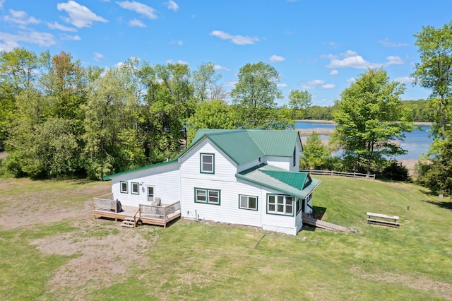3592 Blom Lake Dr, Frederic, WI 54837 - back of property with a deck with water view, metal roof, and view of scattered trees
