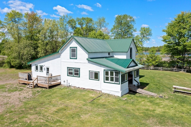 3592 Blom Lake Dr, Frederic, WI 54837 - rear view of property with a wooden deck and metal roof