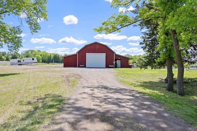 3592 Blom Lake Dr, Frederic, WI 54837 - view of outdoor structure featuring dirt driveway