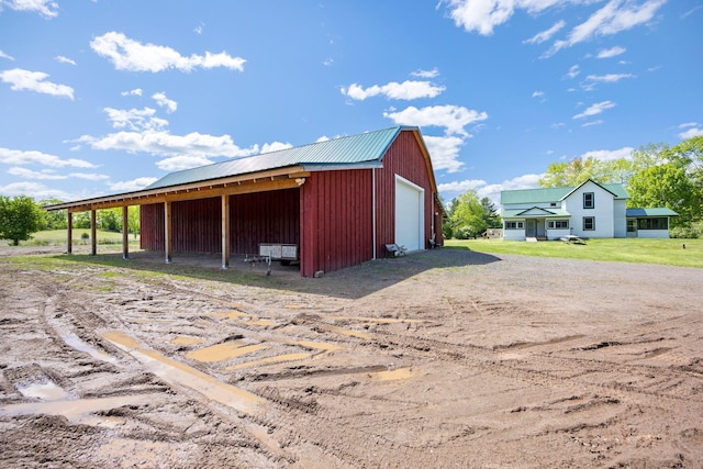 3592 Blom Lake Dr, Frederic, WI 54837 - view of pole building featuring dirt driveway