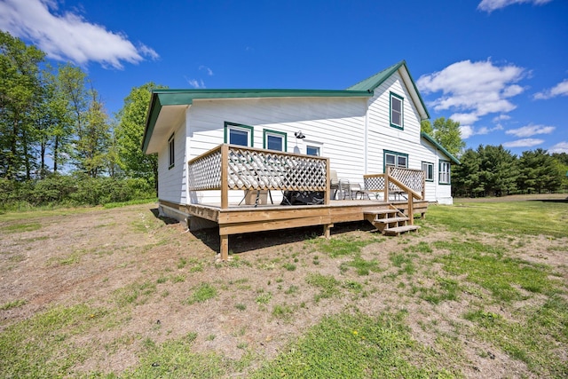 3592 Blom Lake Dr, Frederic, WI 54837 - back of house with a wooden deck and a lawn