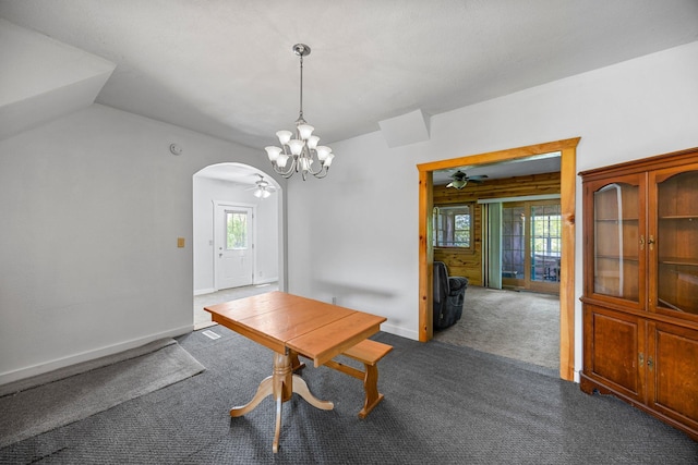 3592 Blom Lake Dr, Frederic, WI 54837 - carpeted dining area featuring arched walkways, ceiling fan, healthy amount of natural light, and a chandelier