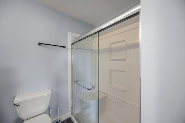 3592 Blom Lake Dr, Frederic, WI 54837 - full bathroom featuring toilet and a shower with shower door