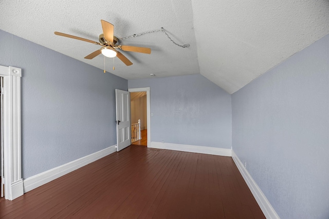 3592 Blom Lake Dr, Frederic, WI 54837 - bonus room with wood finished floors, baseboards, ceiling fan, lofted ceiling, and a textured ceiling