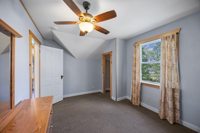 3592 Blom Lake Dr, Frederic, WI 54837 - unfurnished bedroom featuring lofted ceiling, carpet, baseboards, and ceiling fan