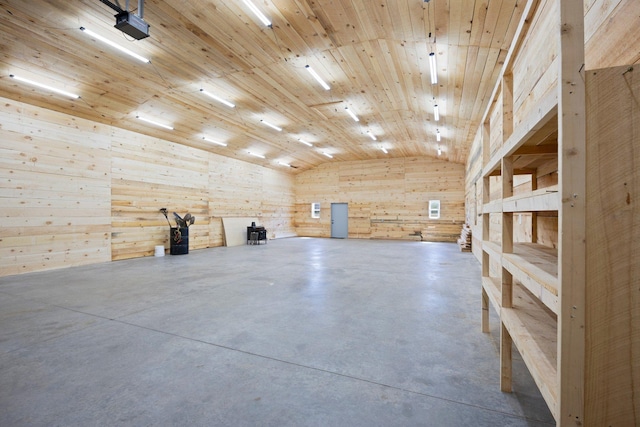 3592 Blom Lake Dr, Frederic, WI 54837 - interior space with vaulted ceiling, concrete flooring, and wooden walls