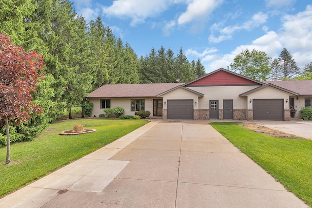 28443 133rd St NW, Baldwin Twp, MN 55398 - view of front of home featuring an attached garage, concrete driveway, a front yard, brick siding, and a fire pit