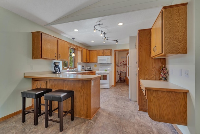 28443 133rd St NW, Baldwin Twp, MN 55398 - kitchen with white appliances, a peninsula, light countertops, a sink, and recessed lighting