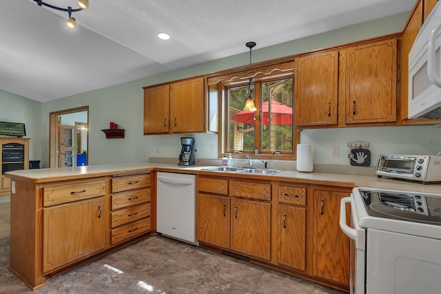 28443 133rd St NW, Baldwin Twp, MN 55398 - kitchen with white appliances, a sink, a peninsula, light countertops, and brown cabinetry