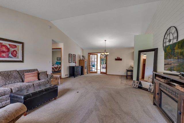 28443 133rd St NW, Baldwin Twp, MN 55398 - living room with a chandelier, vaulted ceiling, light colored carpet, and baseboards