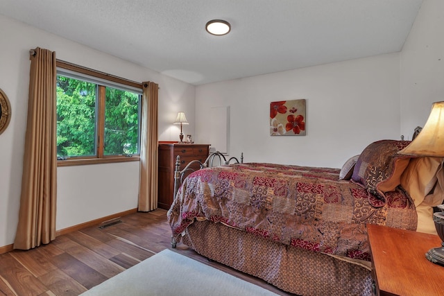 28443 133rd St NW, Baldwin Twp, MN 55398 - bedroom featuring wood finished floors and baseboards