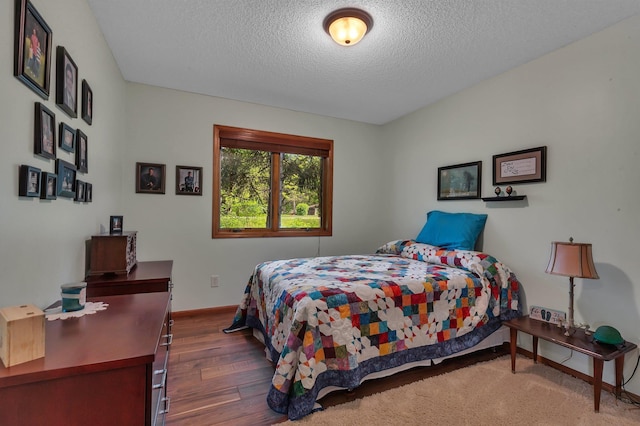 28443 133rd St NW, Baldwin Twp, MN 55398 - bedroom with a textured ceiling, wood finished floors, and baseboards