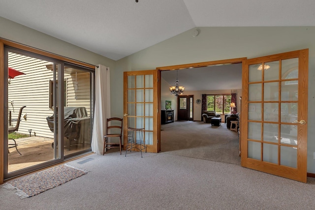 28443 133rd St NW, Baldwin Twp, MN 55398 - spare room with french doors, carpet flooring, vaulted ceiling, and a chandelier