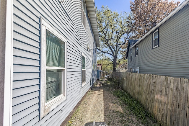 view of property exterior with fence