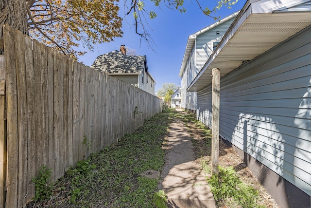 view of home's exterior featuring fence