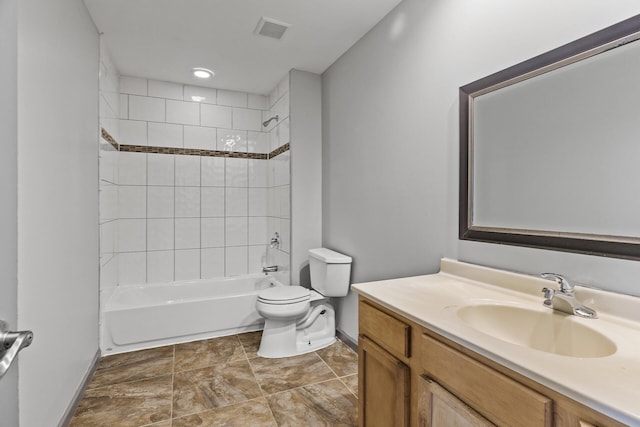bathroom with baseboards, toilet, vanity, and washtub / shower combination