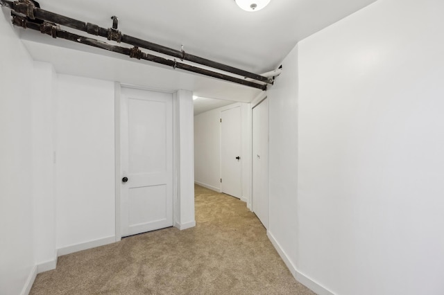 below grade area with carpet and baseboards