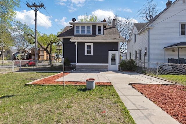 983 Sherburne Ave, Saint Paul, MN 55104 - view of front facade with roof with shingles, a chimney, and a patio area
