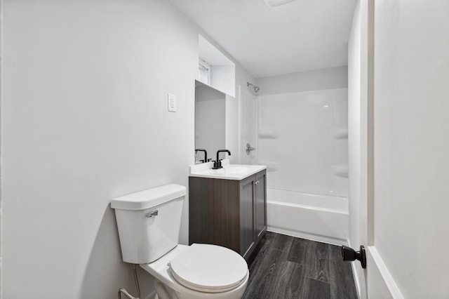 983 Sherburne Ave, Saint Paul, MN 55104 - full bathroom with wood finished floors, toilet, vanity, and  shower combination
