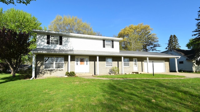 536 3rd Ave, Wanamingo, MN 55983 - view of front of home with a garage, a front lawn, and driveway