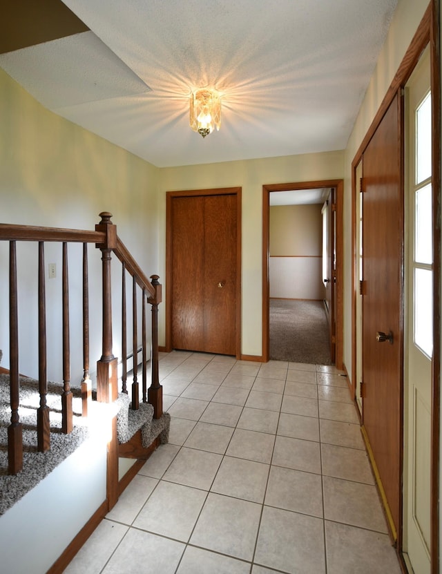 536 3rd Ave, Wanamingo, MN 55983 - entrance foyer featuring healthy amount of natural light, light tile patterned flooring, and stairway