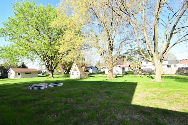 536 3rd Ave, Wanamingo, MN 55983 - view of green lawn with a residential view and an outdoor structure