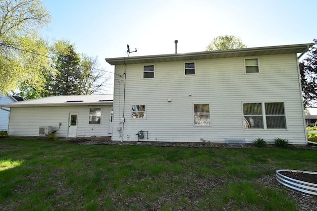 536 3rd Ave, Wanamingo, MN 55983 - rear view of property with a lawn and ac unit