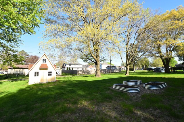 536 3rd Ave, Wanamingo, MN 55983 - view of yard featuring a shed and an outdoor structure