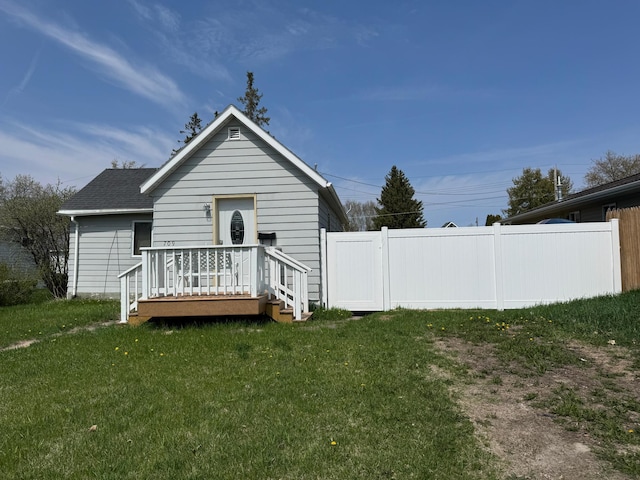 709 Center St E, Roseau, MN 56751 - rear view of house with a shingled roof