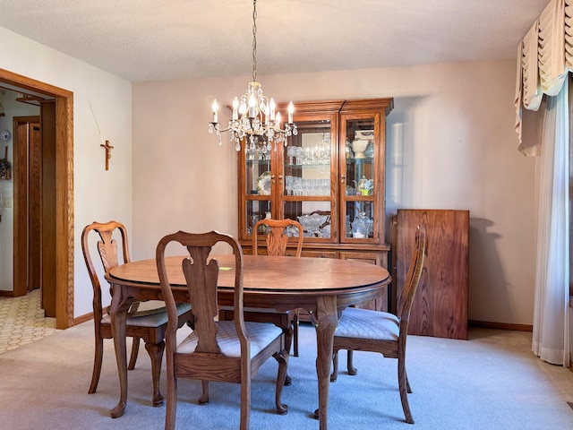 1626 Diane Rd, Mendota Heights, MN 55118 - dining room with a chandelier, light colored carpet, and baseboards