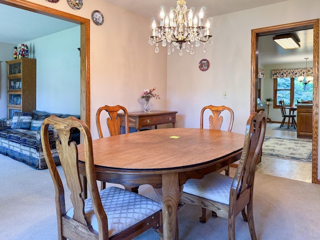 1626 Diane Rd, Mendota Heights, MN 55118 - carpeted dining space featuring a chandelier