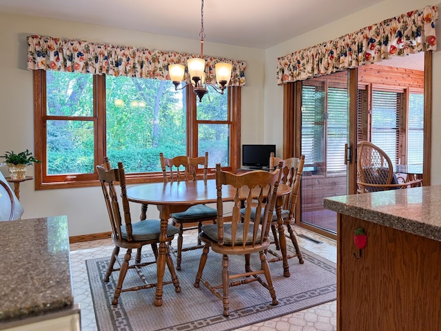 1626 Diane Rd, Mendota Heights, MN 55118 - dining space with a chandelier, plenty of natural light, and baseboards